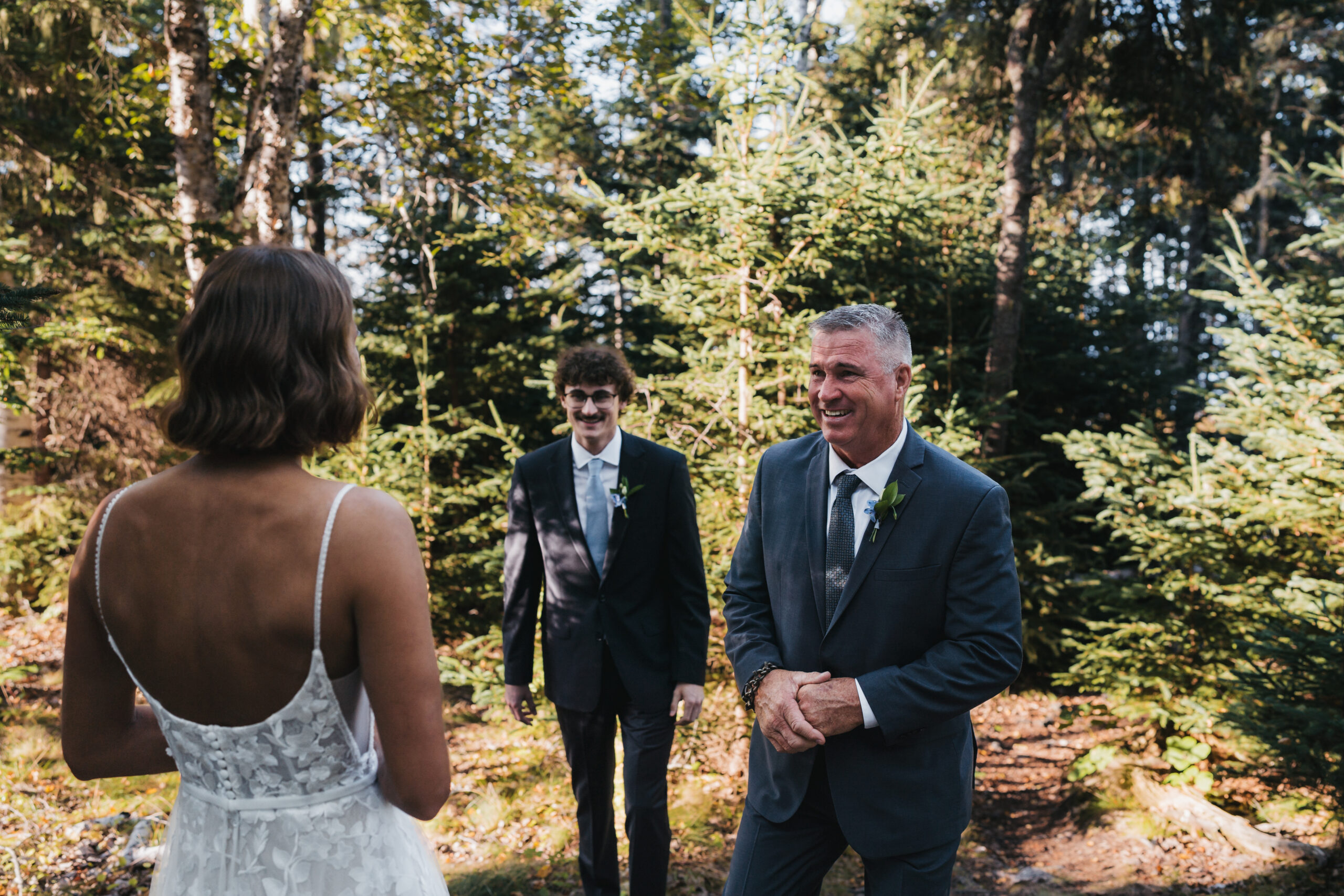 Bride sharing an emotional first look with her father during a Sunrise Acadia Elopement.