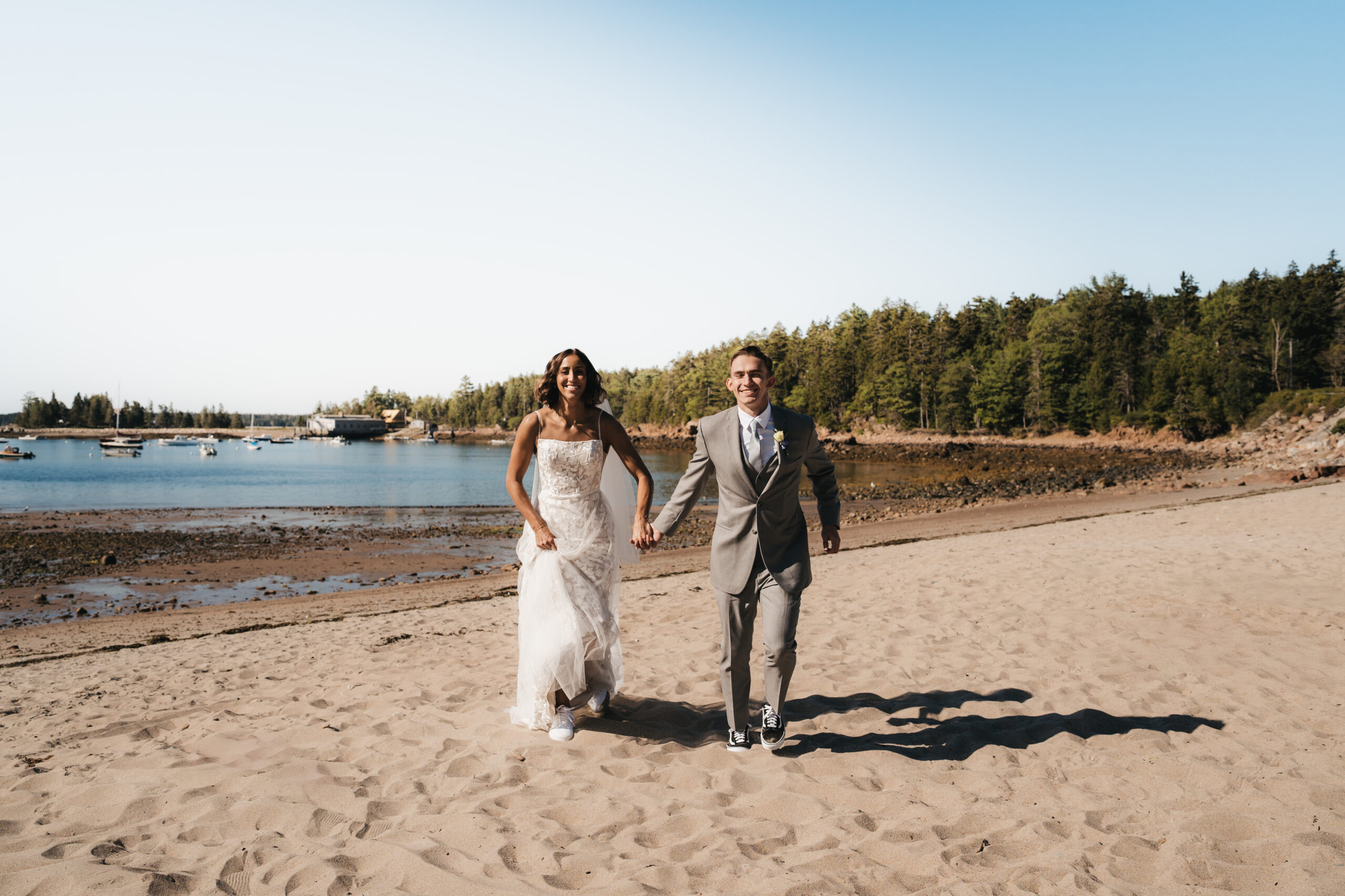 Couple exploring Seal Harbor Beach during a Sunrise Acadia Elopement.